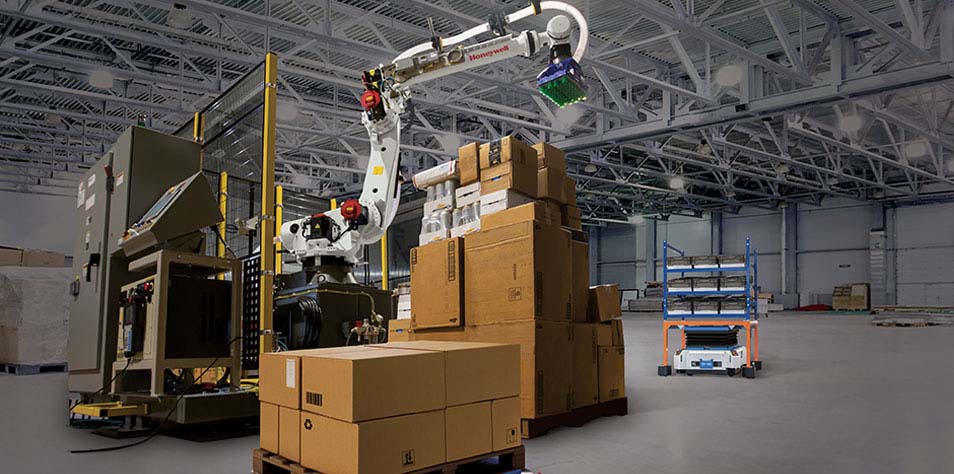 A mixed SKU depalletizer and an autonomous mobile robot move product in a distribution center